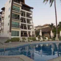 Front view of pool area and building.
